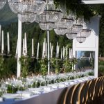 dinner table with chandeliers