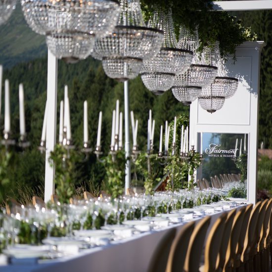 dinner table with chandeliers